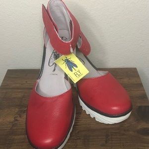 NWOT Fly London Yand size 9 (EU40) red leather ankle strap wedge shoe.
